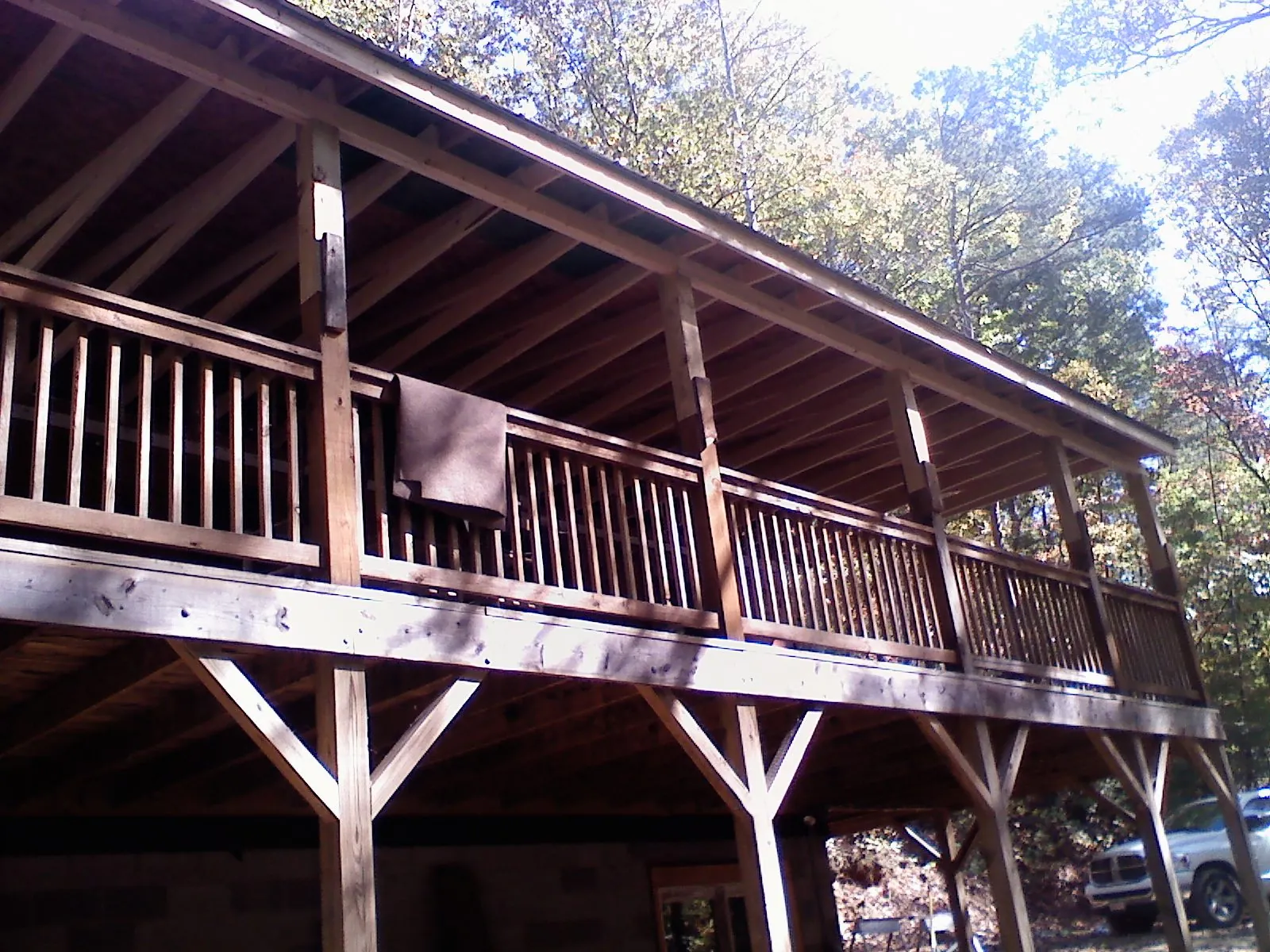 Timber framing under a new elevated porch and deck in Youngsville